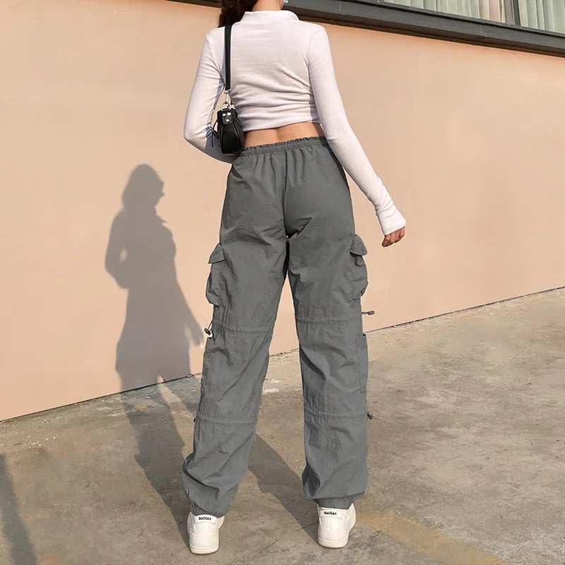 American street style design with multiple pockets, workwear with drawstring elastic and loose fit, hip-hop low waist sports pan